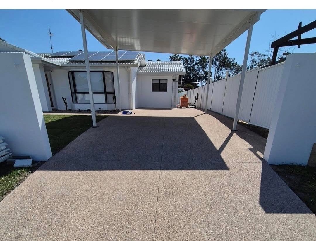 Exposed aggregate driveway under pergola Gold Coast